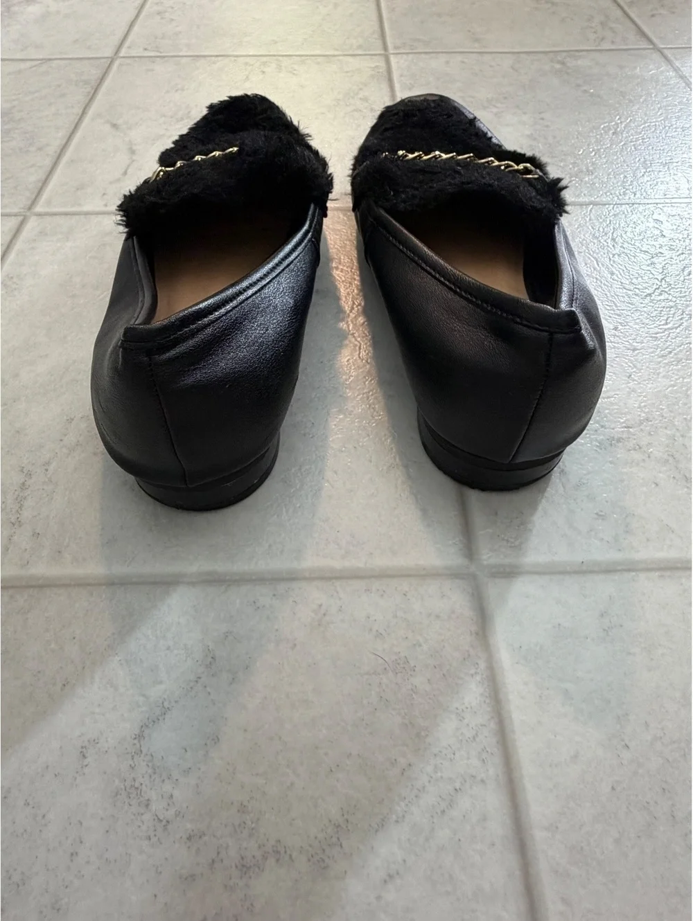 Black loafers with chain detail